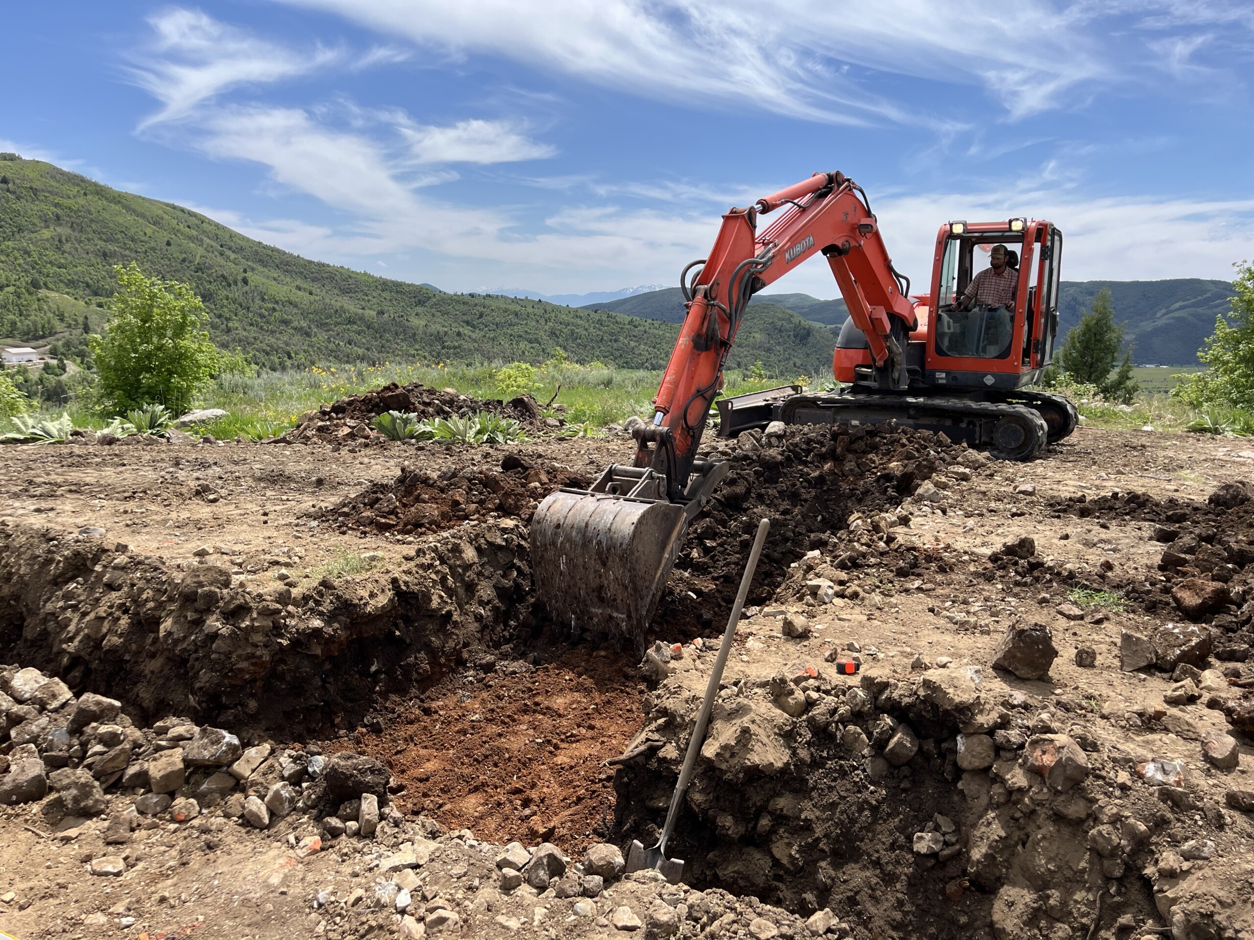 Excavator digging a trench